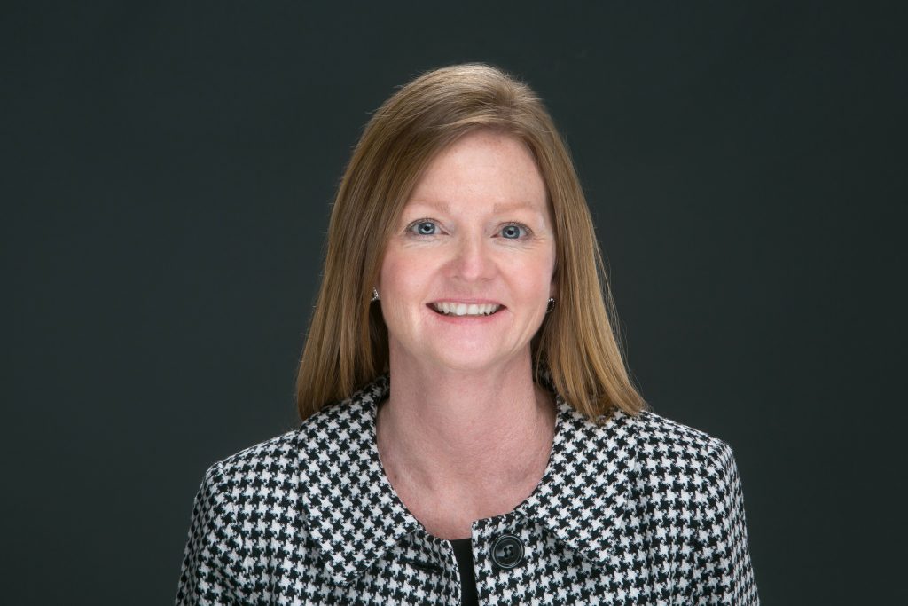 Stacey Button, CEcD